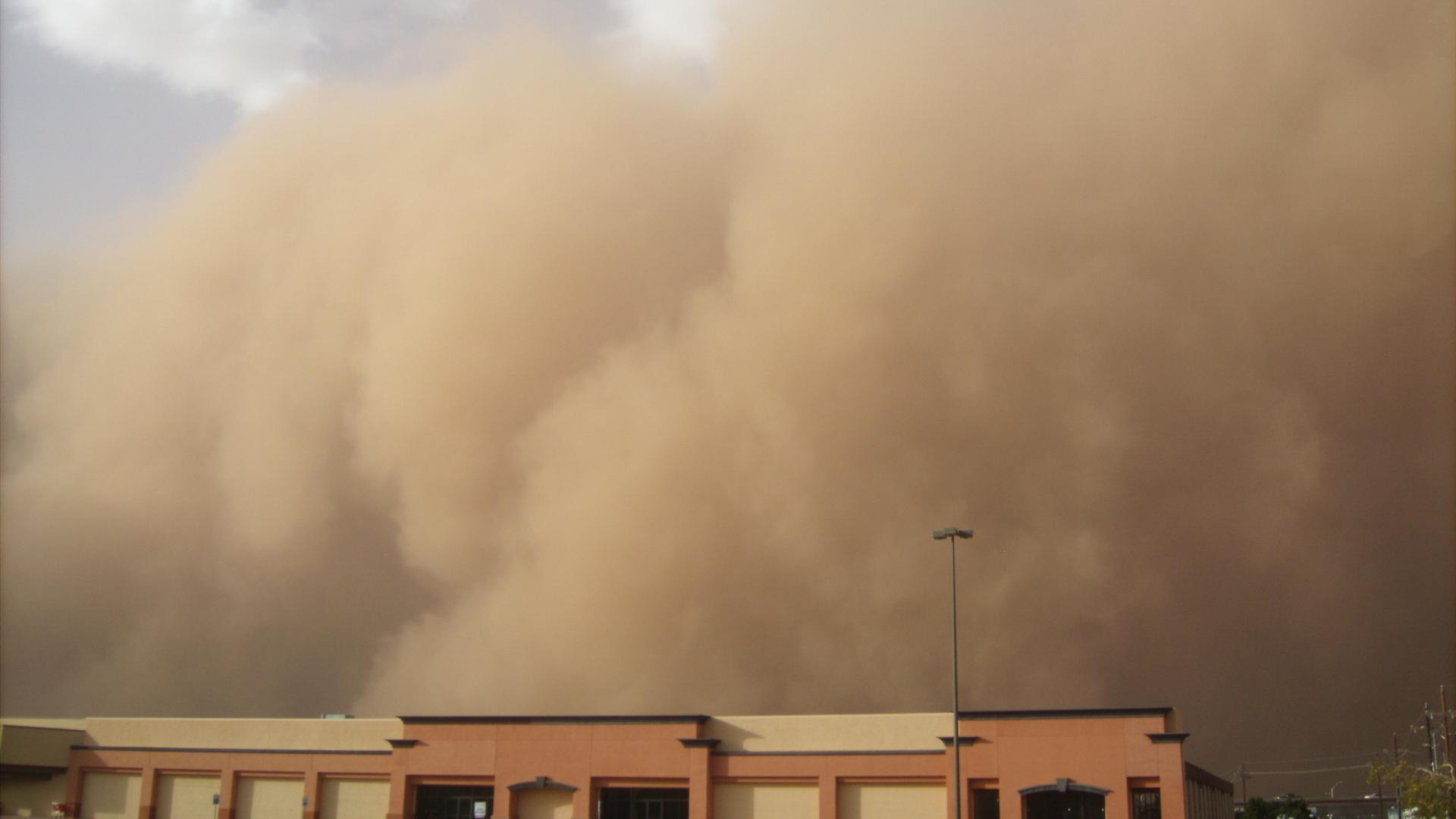 Dust cloud over building