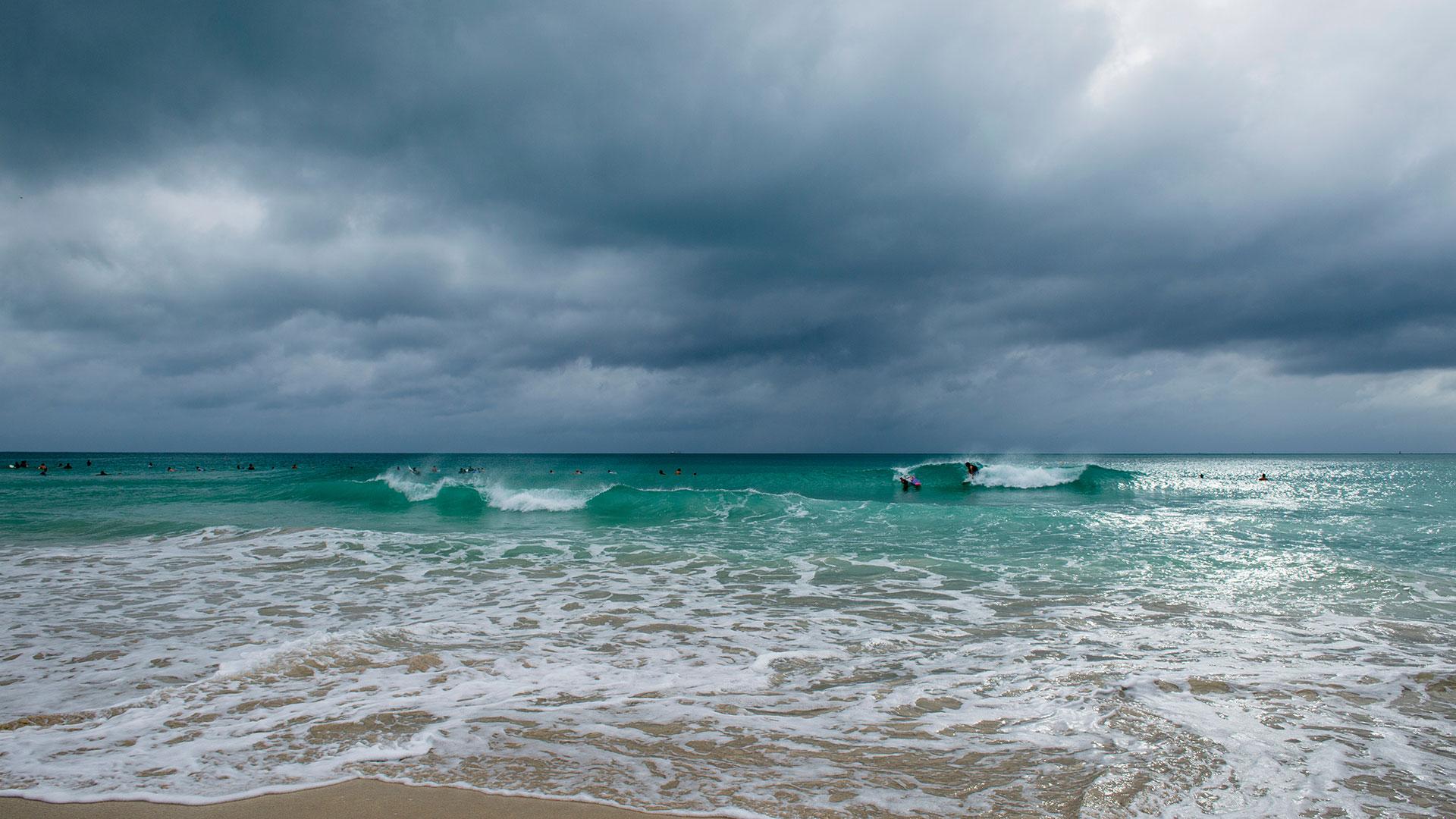 Storm clouds over a tropical beach. Credit: lazyllama 
