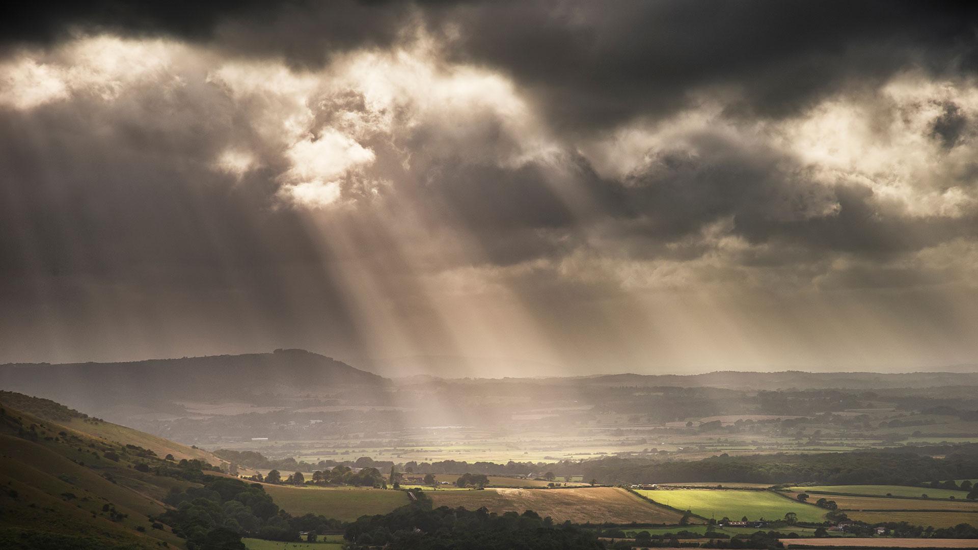 Storms clouds with sun rays