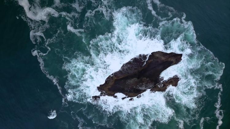 Ocean with rock from pexel