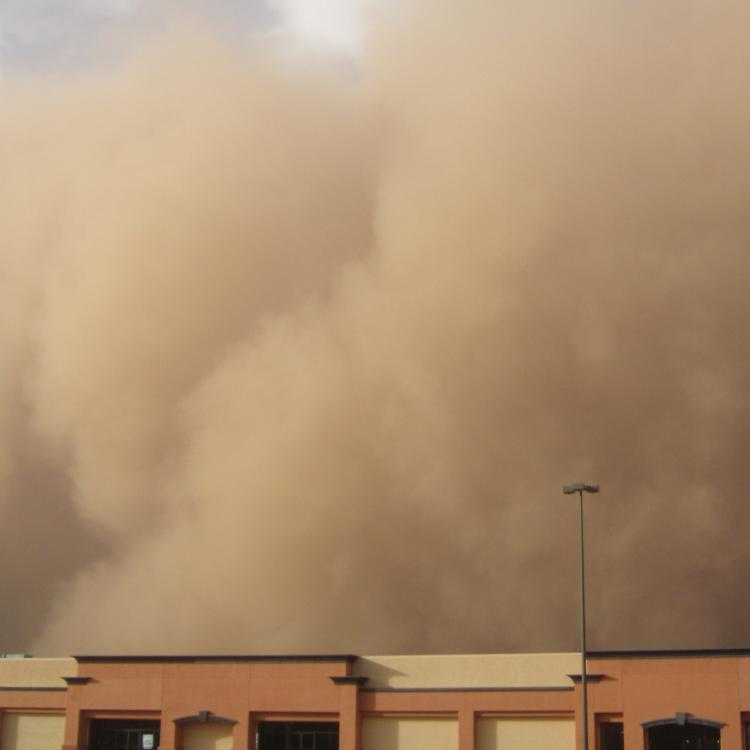 Dust cloud over building
