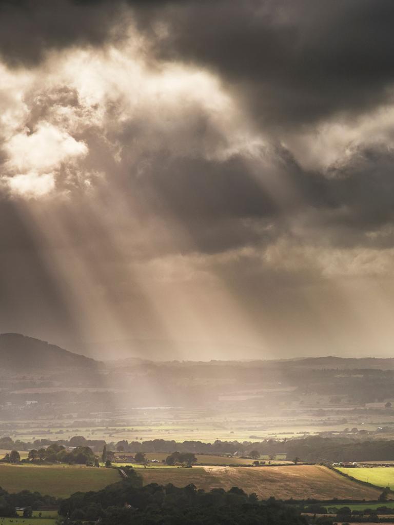 Storms clouds with sun rays